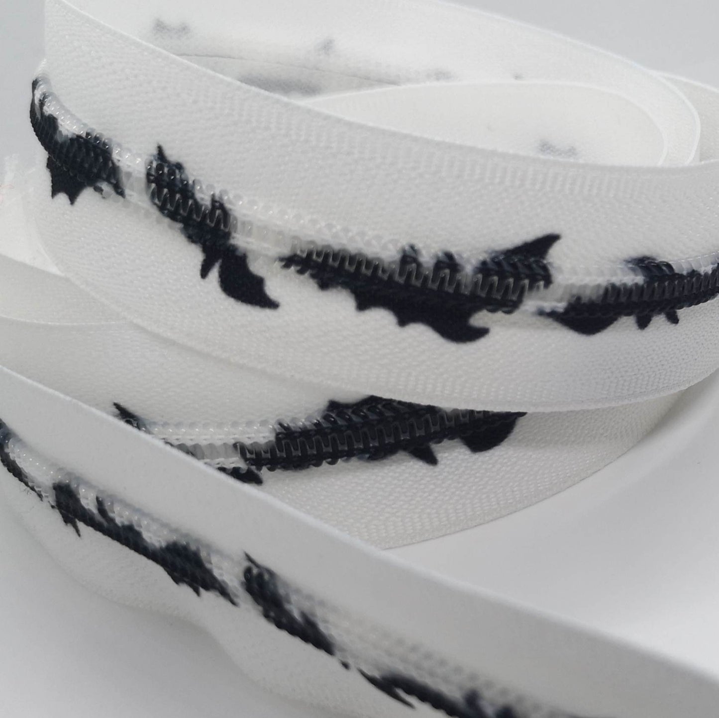 White Bats Zipper Sold by the meter