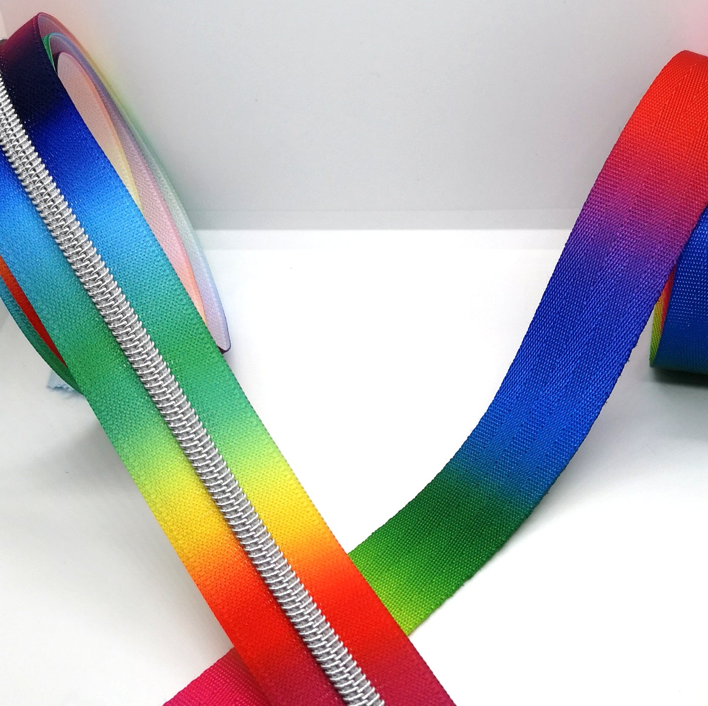 Bright Rainbow with silver teeth zipper tape